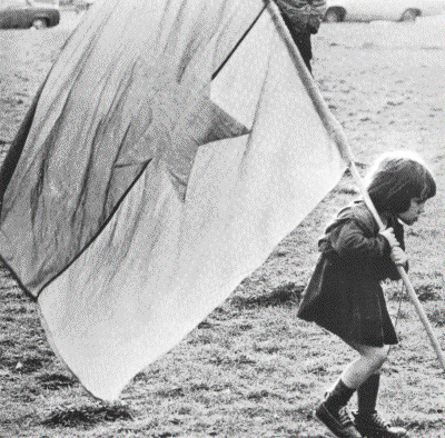 child carrying an FNL flag